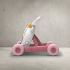 Side view of bear-face baby walker with pink wheels