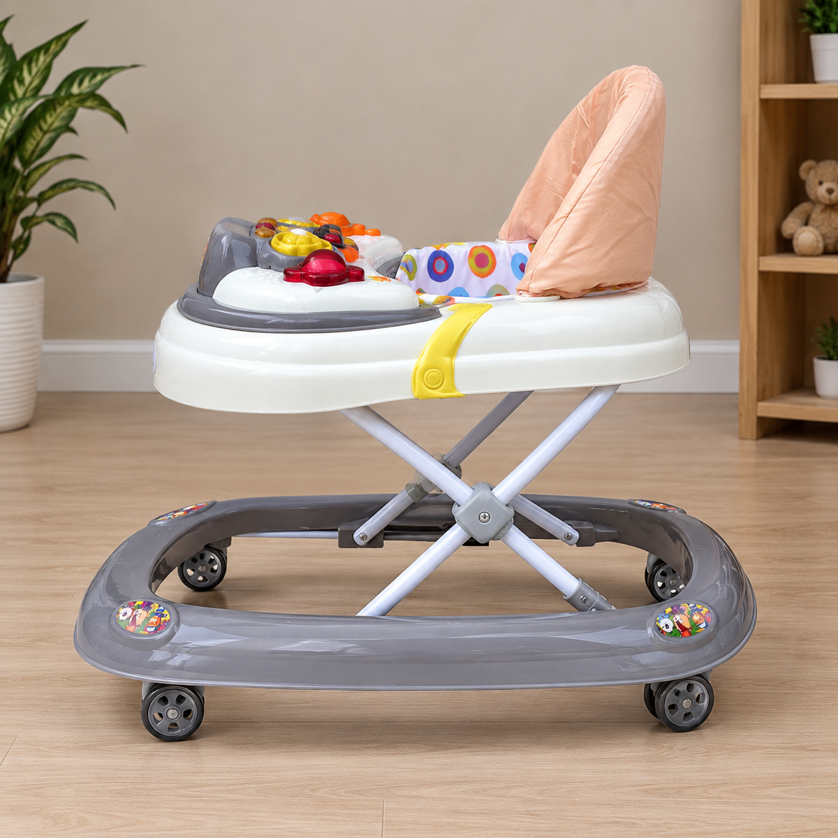 Side view of cream baby walker with peach seat