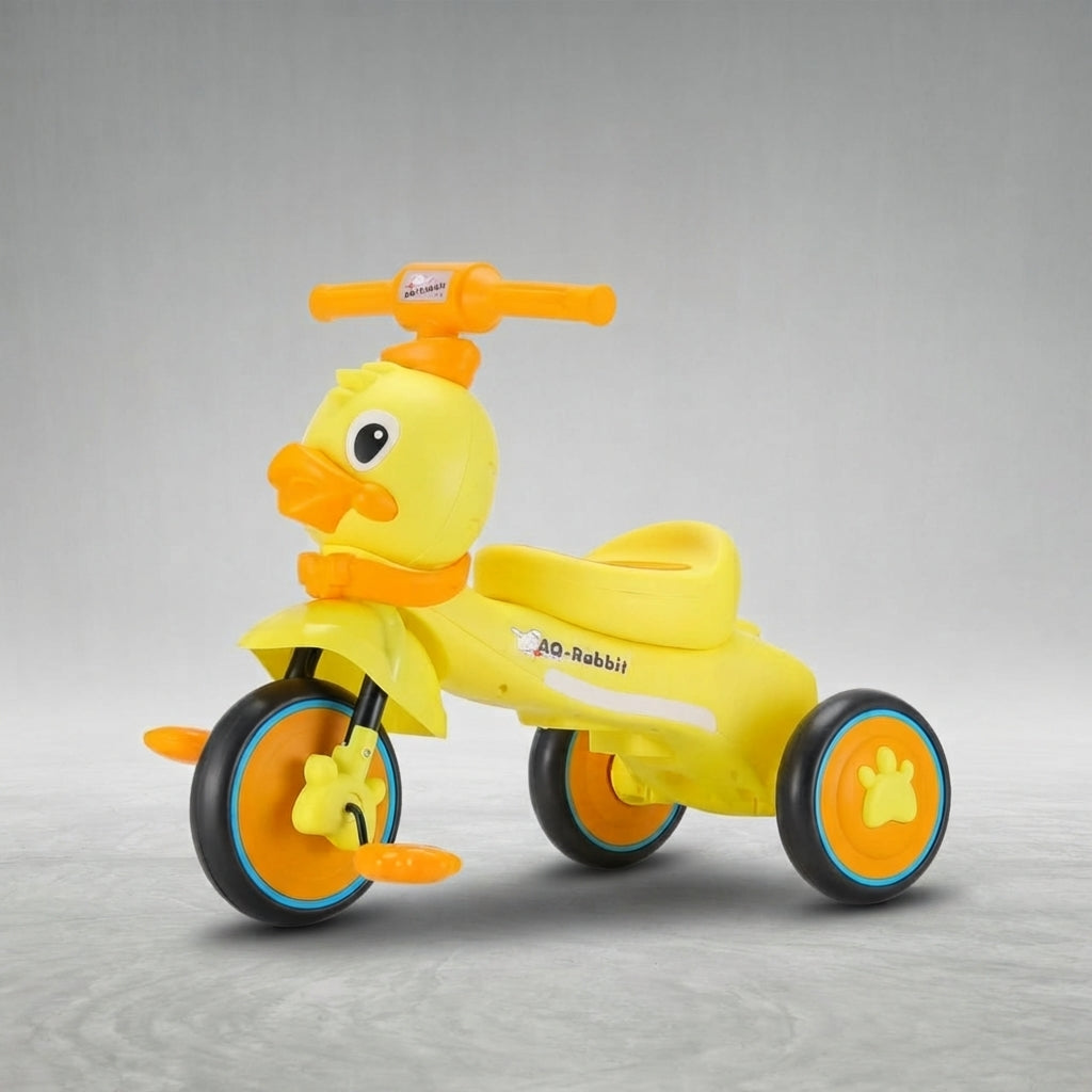 Angled view of duck kids tricycle with orange wheels
