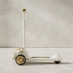 Side view of white gold kids scooter with LED wheels