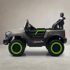 Side view of grey off-road ride-on jeep with green wheels