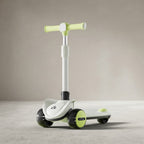 Lime green and white kids scooter with LED wheels, angled view