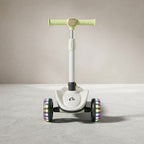 Front view of lime green scooter showing LED light-up rear wheels